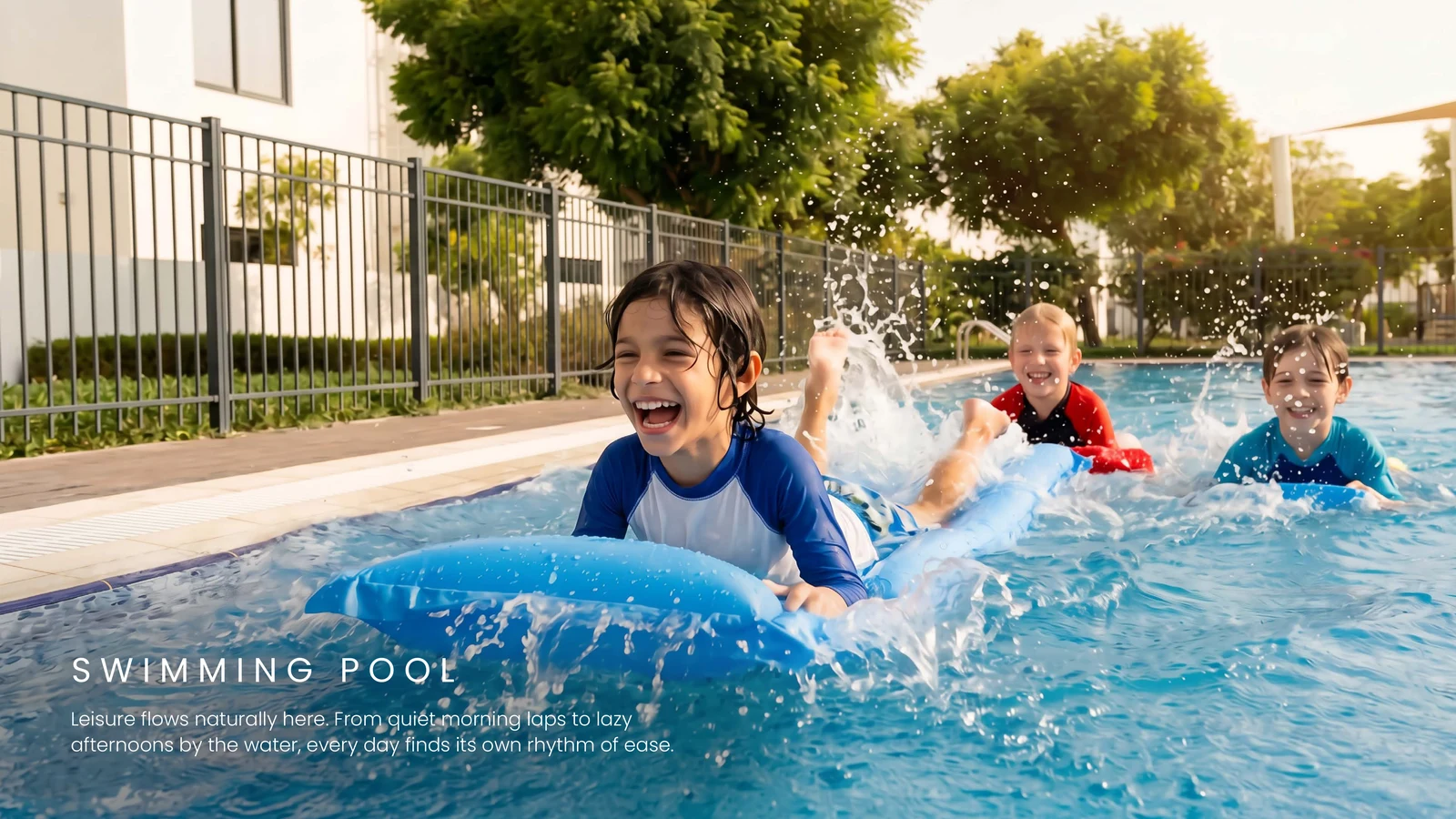 Shallow kids' pool beside loungers at Al Ghadeer amenities