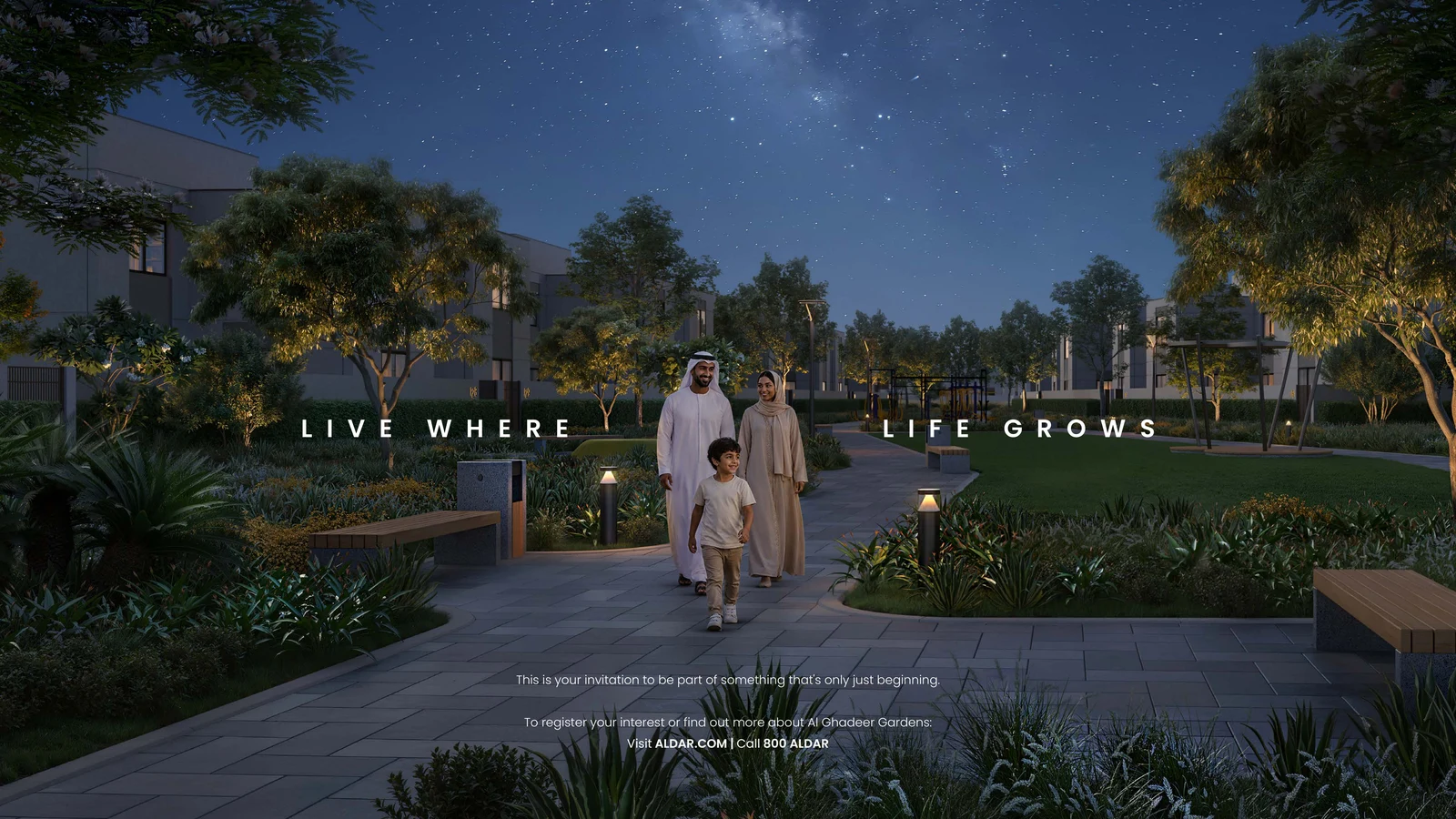 Twilight view across Al Ghadeer Gardens villas and palm-lined streets