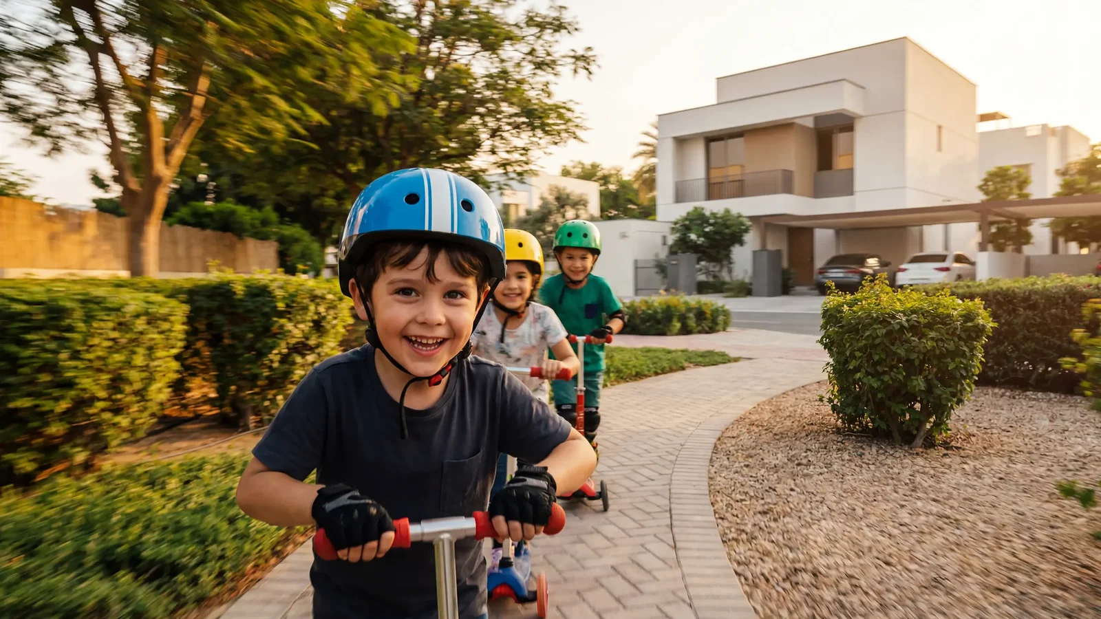 Residents sandboarding on dunes at the desert edge of Al Ghadeer
