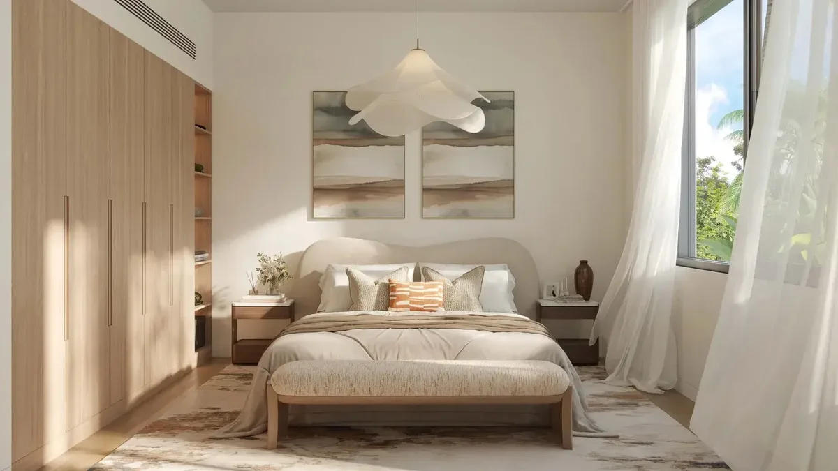 Al Ghadeer Gardens bedroom dressed in the light finish palette