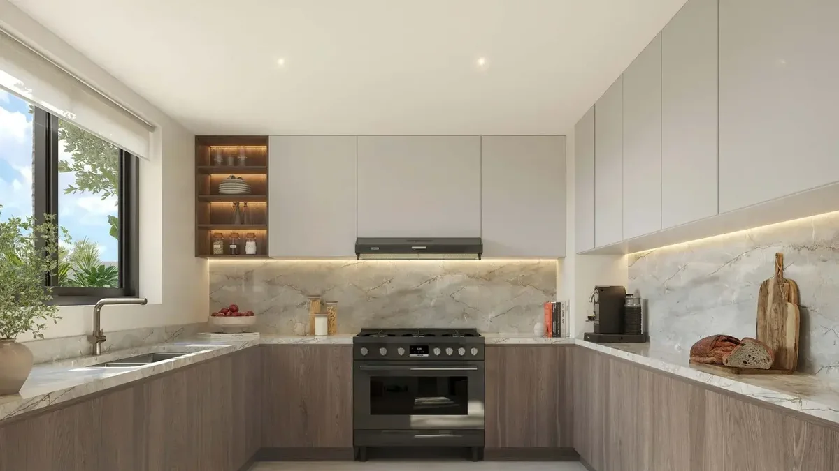 Al Ghadeer Gardens kitchen in the dark finish palette