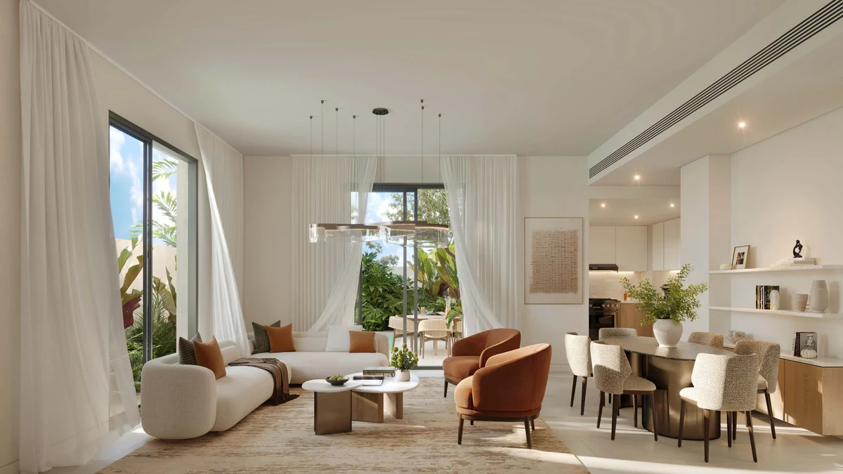 Wide view of an Al Ghadeer Gardens living room, light palette