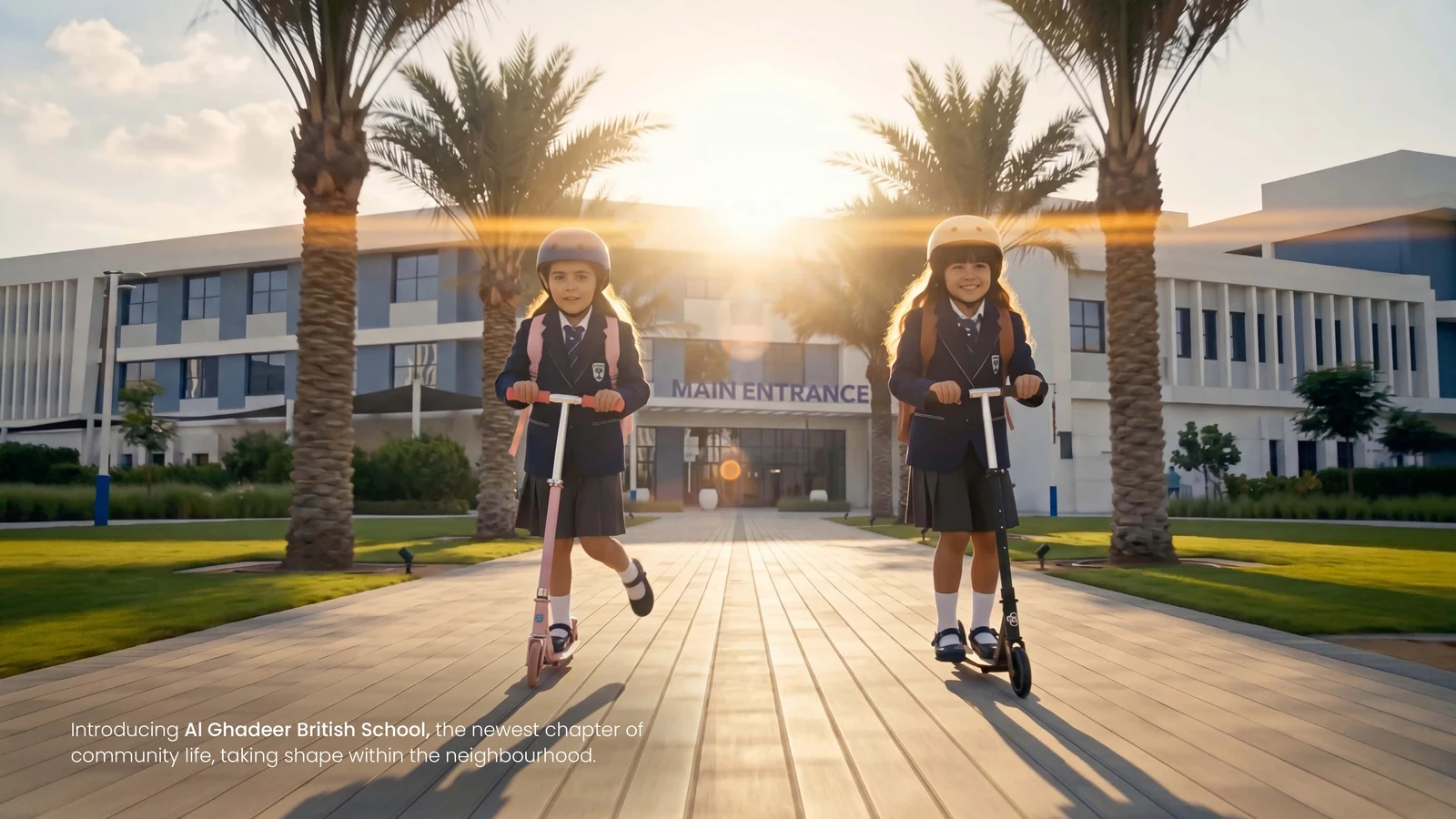 Children on scooters arriving at Al Ghadeer British School main entrance