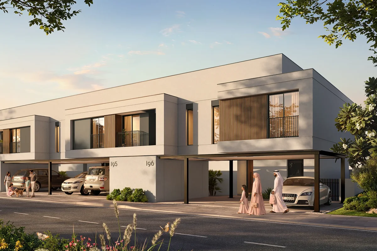 Row of Al Ghadeer Gardens townhouses in late-afternoon golden light